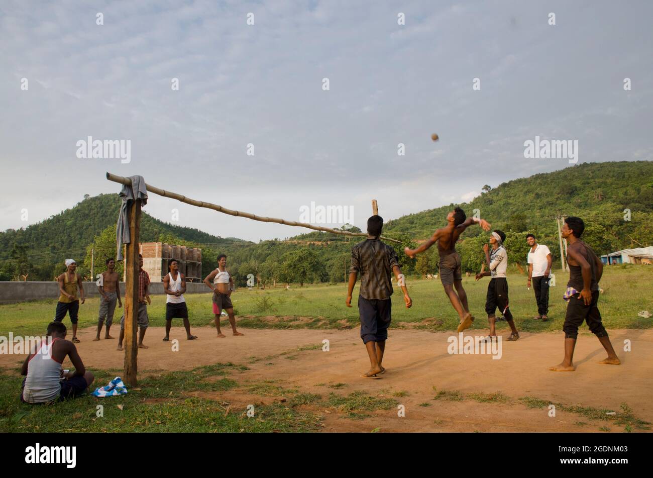 Villagers are playing a local volleyball game in Odisha, India. Stock Photo