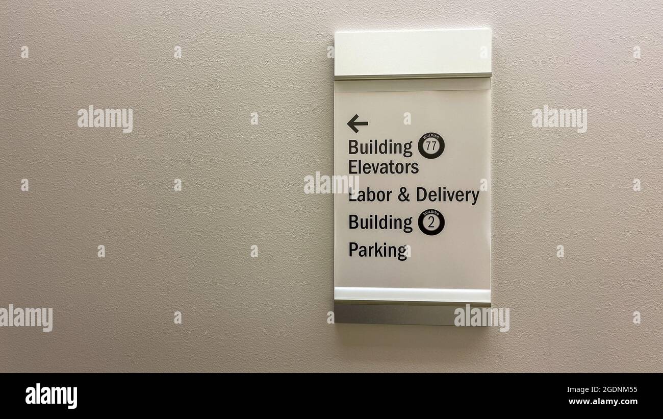 The building elevator and labor and delivery sign for a hospital. Stock Photo