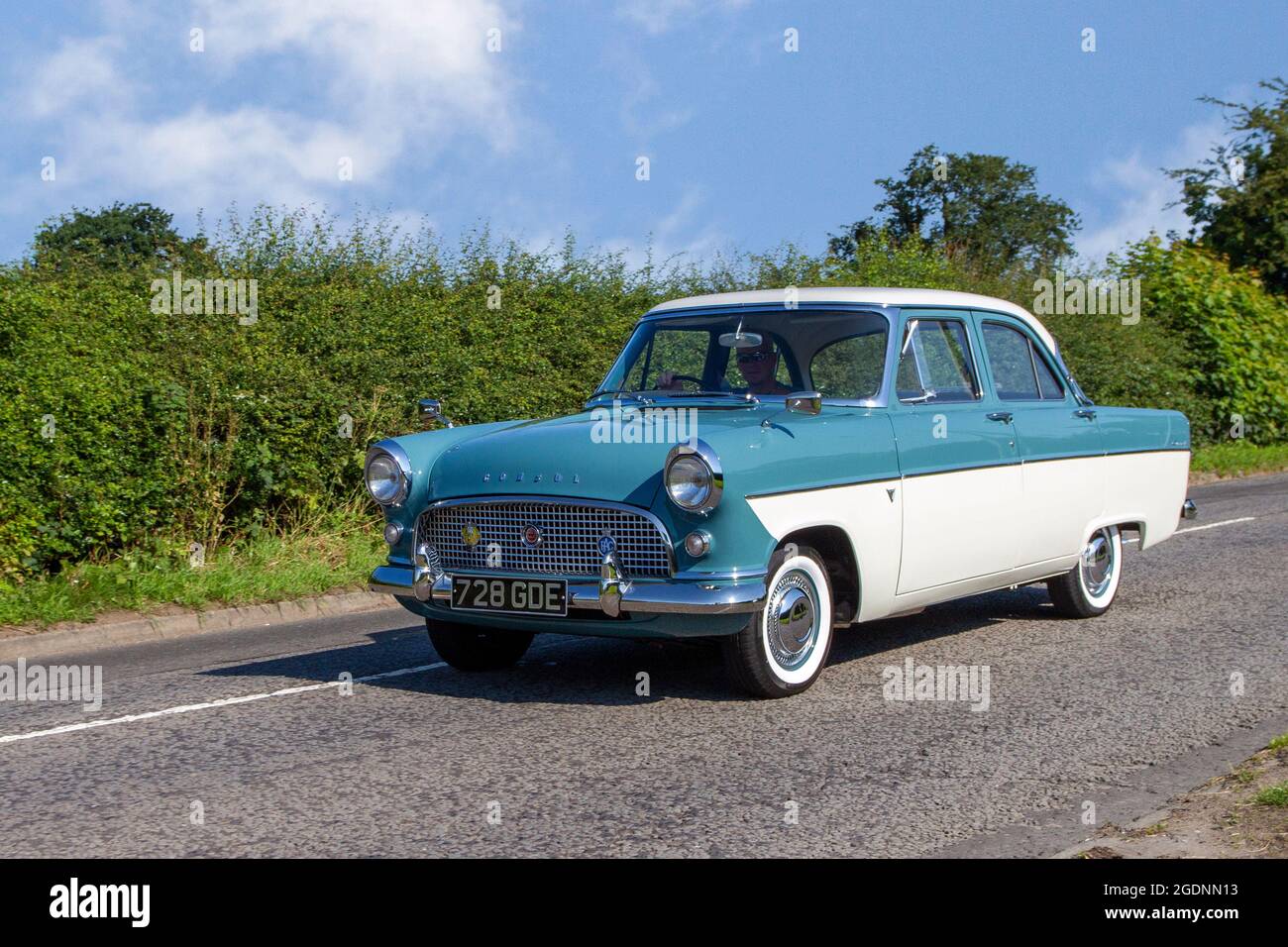 1960 60s sixties Ford Consul blue white 1703cc petrol,  4dr saloon, en-route to Capesthorne Hall classic May car show, Cheshire, UK Stock Photo
