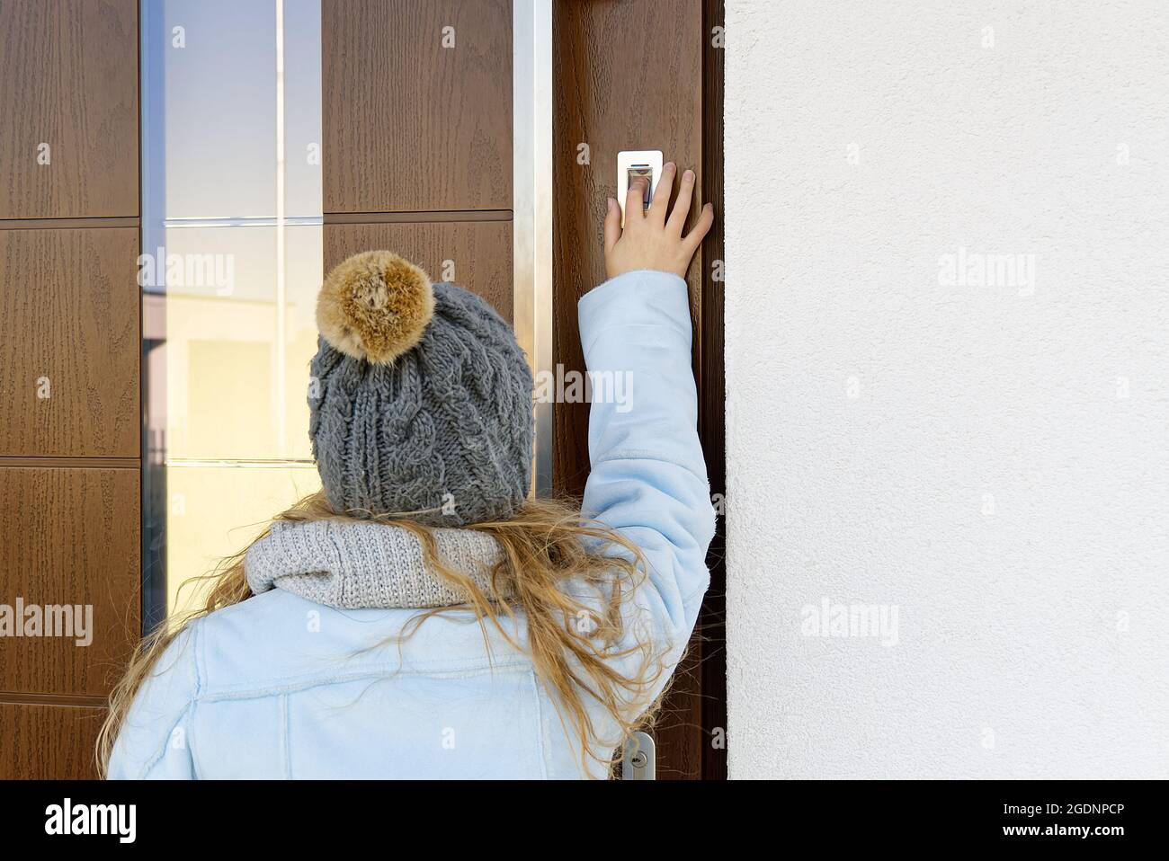 Young Girl opening door using Biometric Fingerprint Scanner lock for