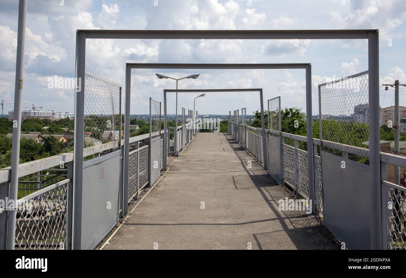 Railway bridge with steps, with impressive steps in perspective. Overhead pedestrian crossing