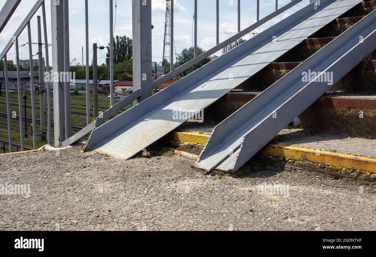 The staircase of the pedestrian crossing with traces of destruction