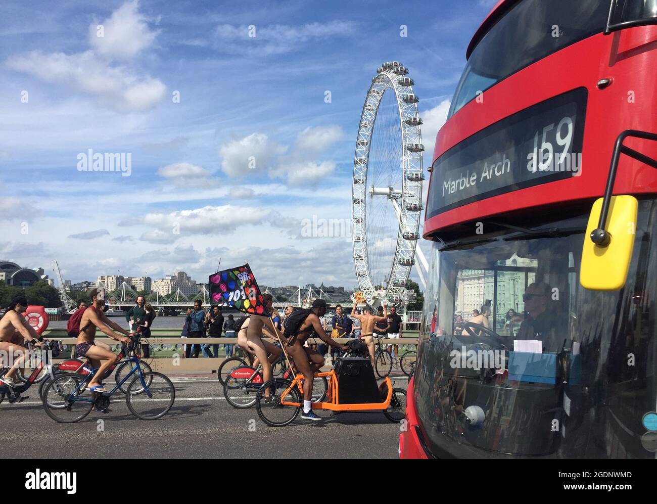 Naked cyclists cross Westminster Bridge in central London on World
