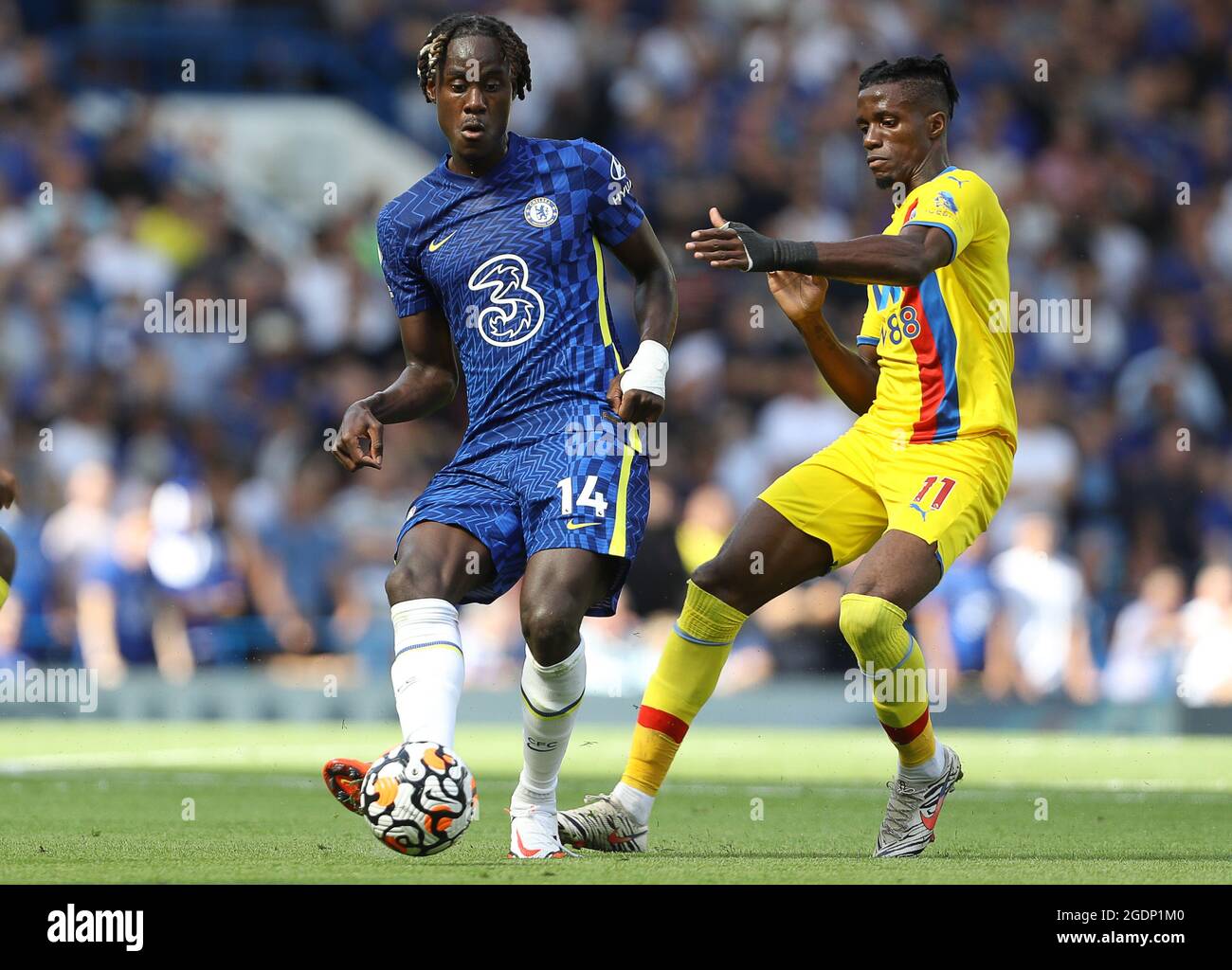 London, England, 14th August 2021. Trevor Chalobah of Chelsea and Wilfried Zaha of Crystal Palace during the Premier League match at Stamford Bridge, London. Picture credit should read: Paul Terry / Sportimage Stock Photo