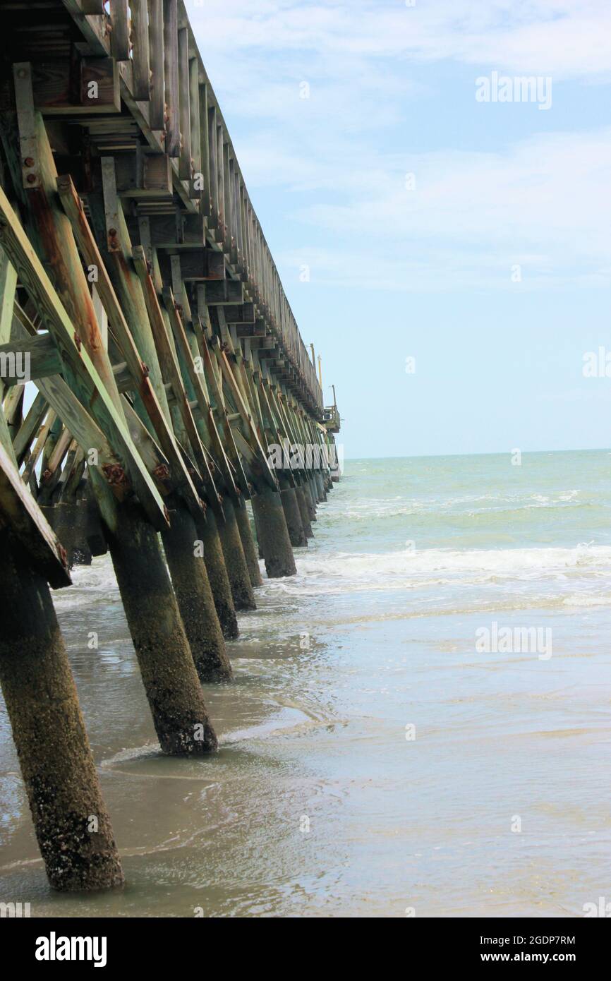 Wooden pier views looking out over the Atlantic ocean Stock Photo