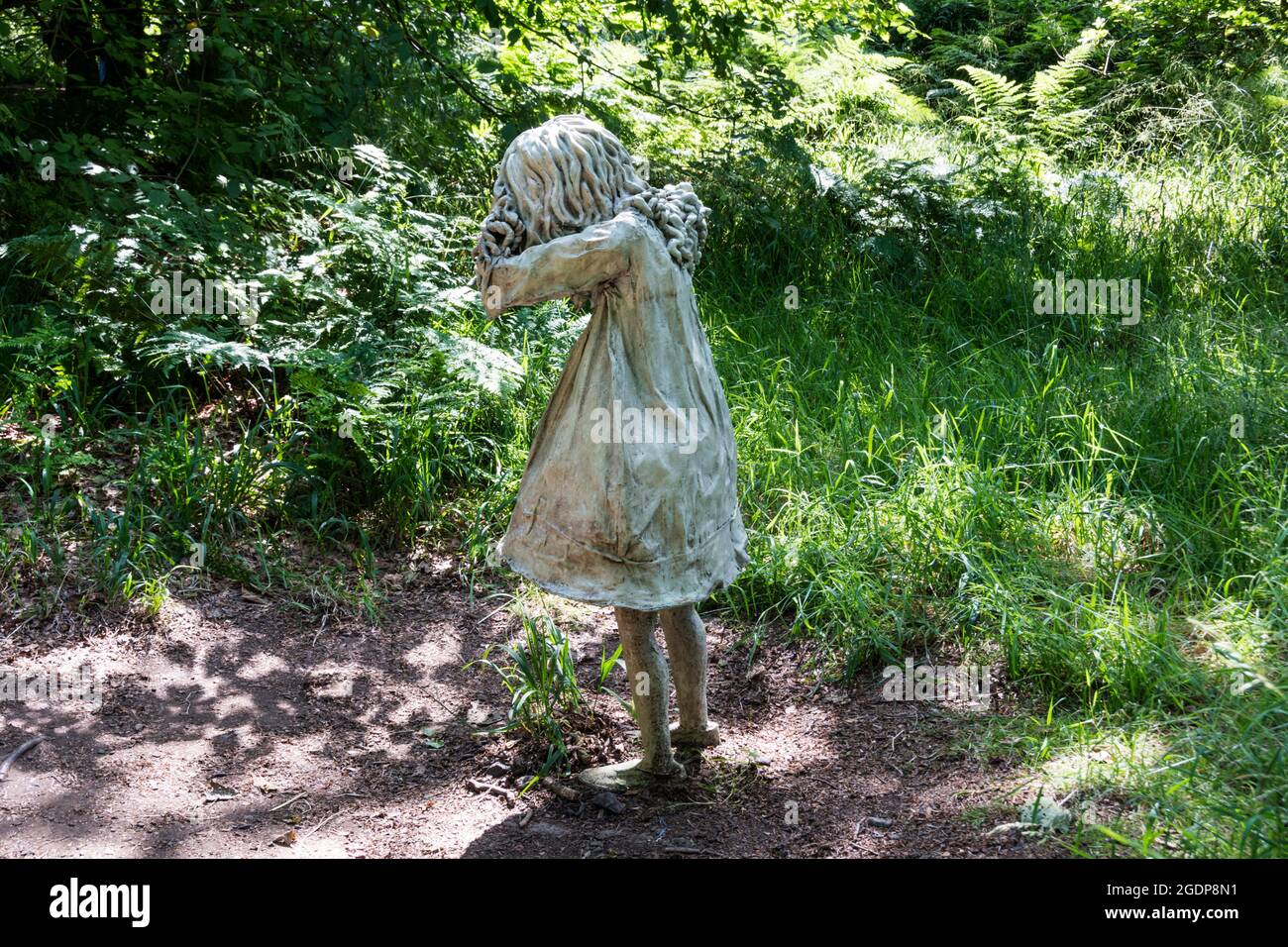 One of the Weeping Girl sculptures by Laura Ford at Jupiter Artland outdoor sculpture park near Edinburgh. Stock Photo