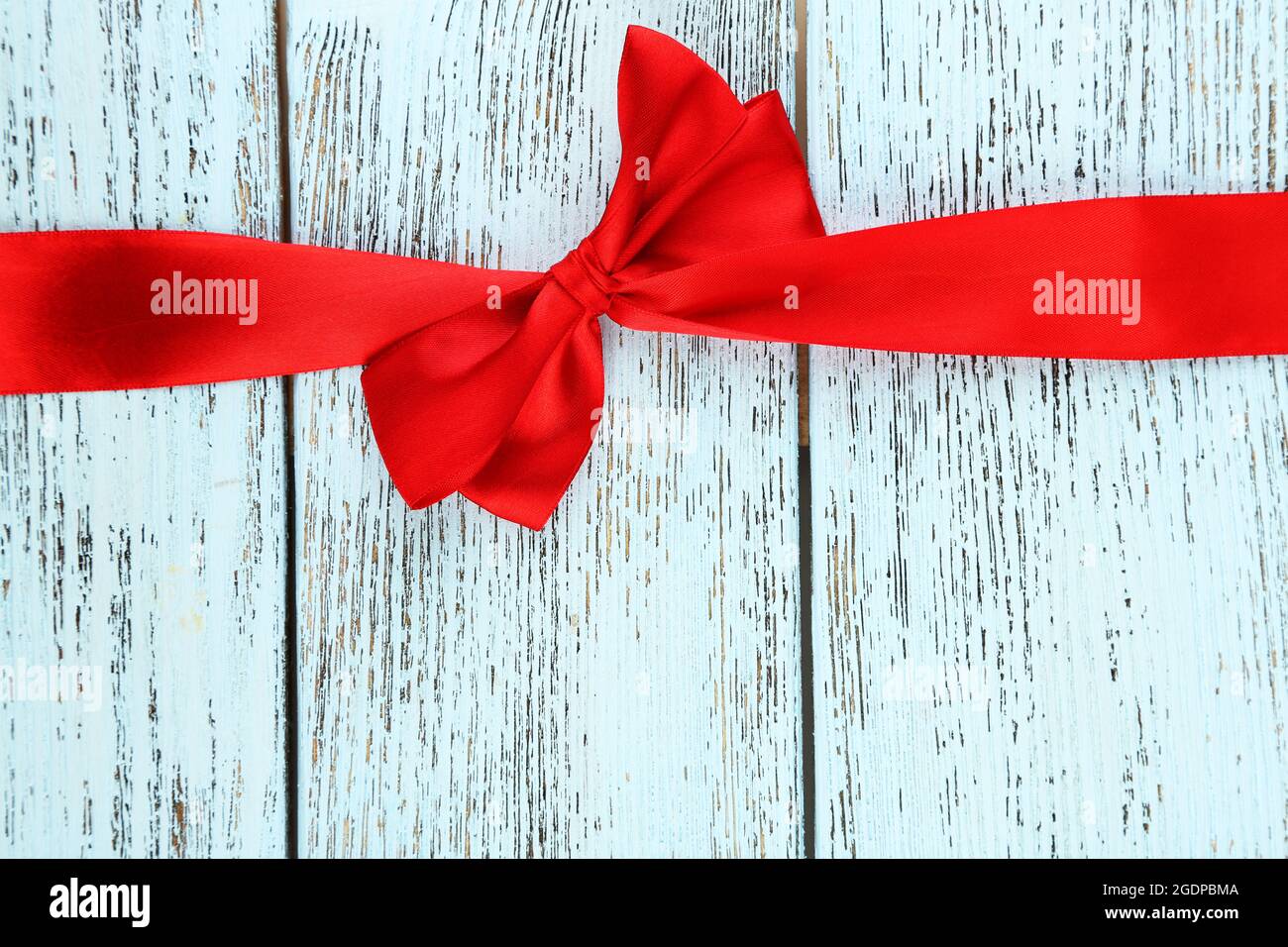 Old wooden background with beautiful bow Stock Photo - Alamy