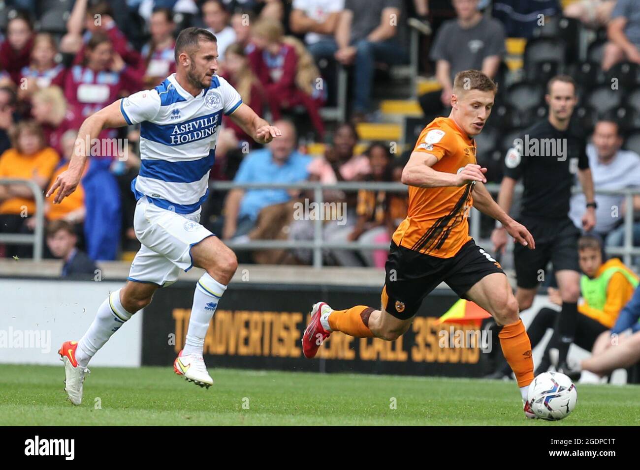 Greg Docherty #8 of Hull City gets away fromDominic Ball #12 of Queens ...