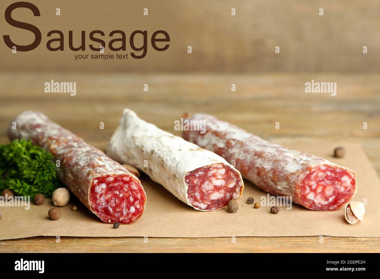 Italian salami ans word SAUSAGE on wooden background Stock Photo Alamy