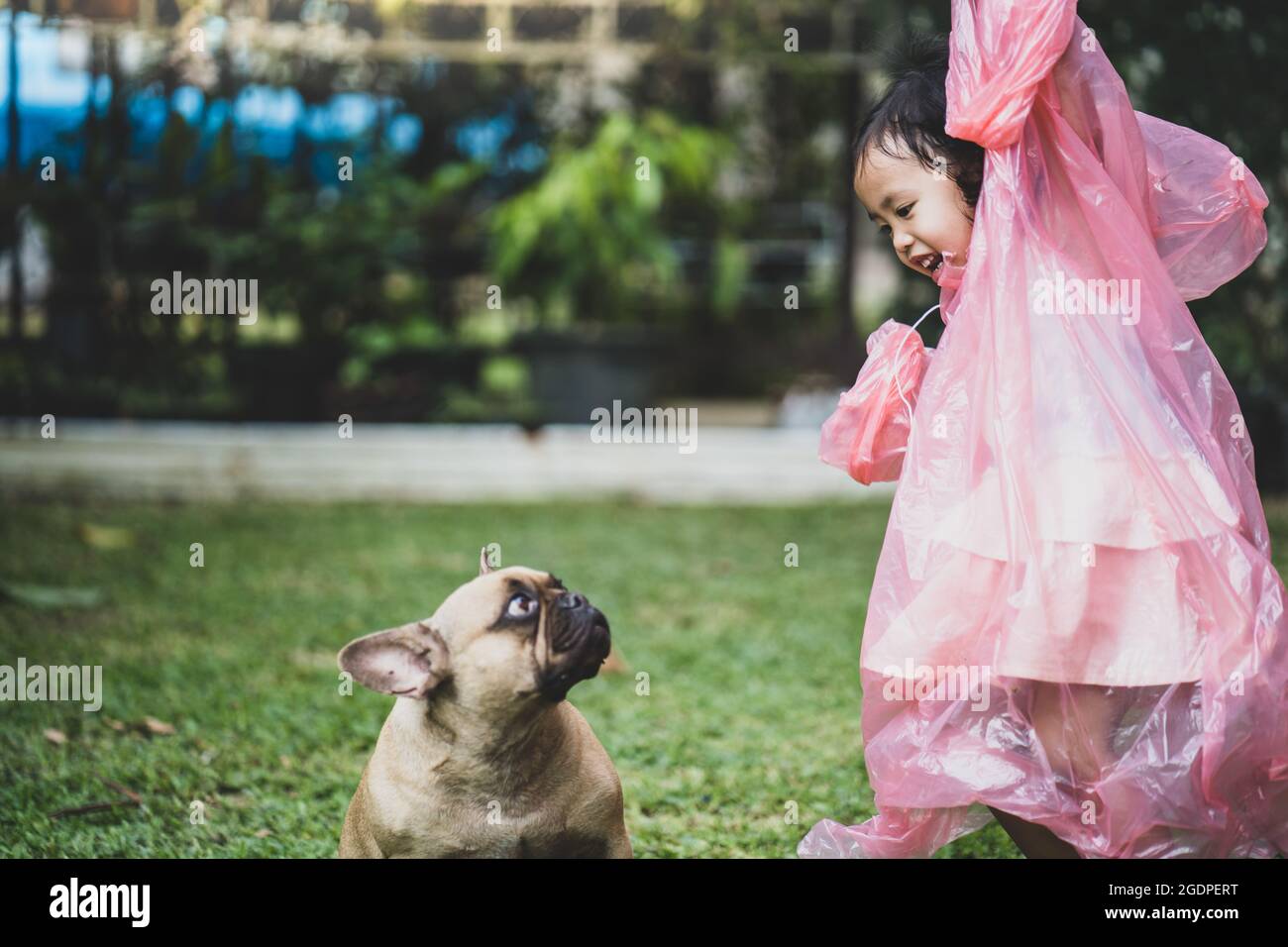 Shot of a little Asian girl wearing red 