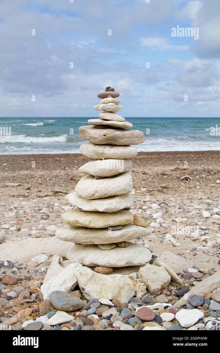Stone tower made of chalk rock on the beach Stock Photo