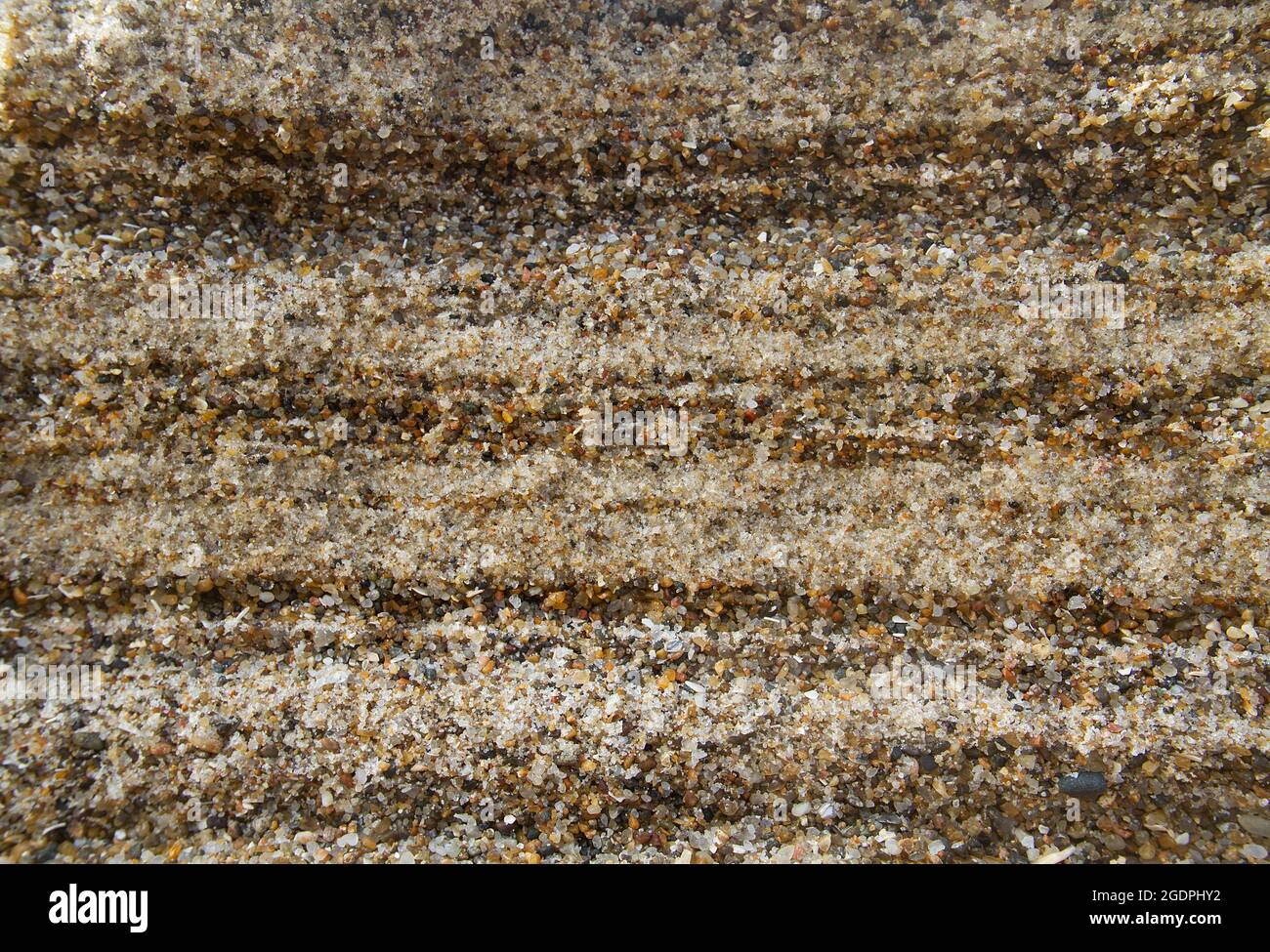 Alternation of layers of coarse sand and gravel in a sediment on the coast  Stock Photo - Alamy