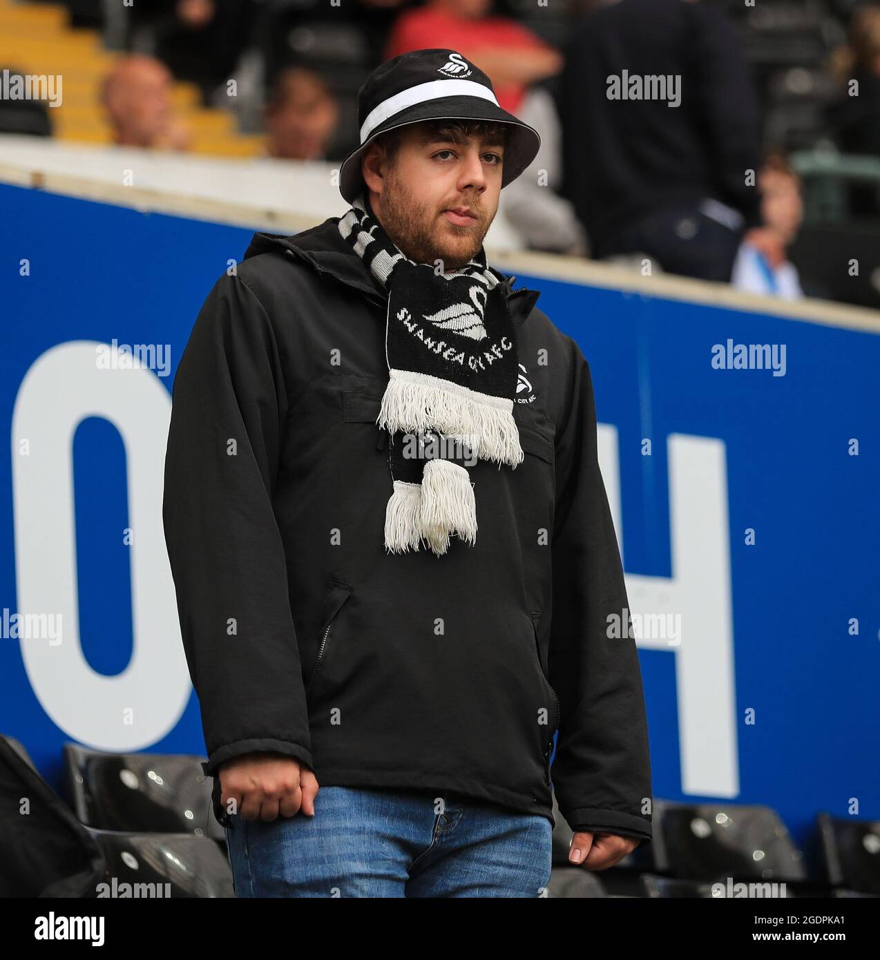 Liberty Stadium, Swansea, UK. 14th Aug, 2021. EFL Championship League football, Swansea versus Sheffield United: A Swansea City fan savours the atmosphere before kick off after a season out with the pandemic Credit: Action Plus Sports/Alamy Live News Stock Photo