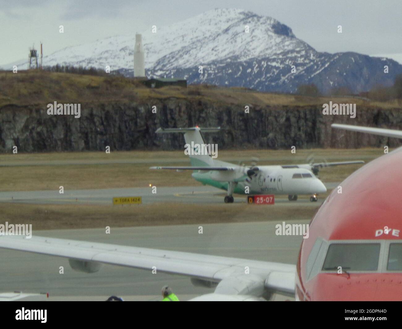 Longyearbyen, Norway - 05.04.2012: Norwegian aircraft at Svalbard airport Longyear (LYR) - northernmost airport in the world with public scheduled fli Stock Photo