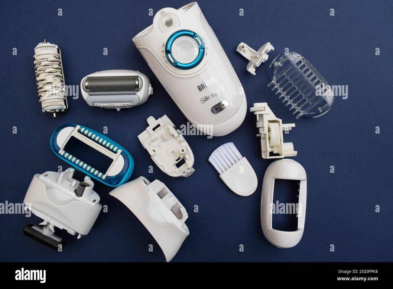 Braun epilator for women, with many parts, it is opened and repaired  unscrewed for cleaning purpose. Many parts of epilator with razor combo  Stock Photo - Alamy