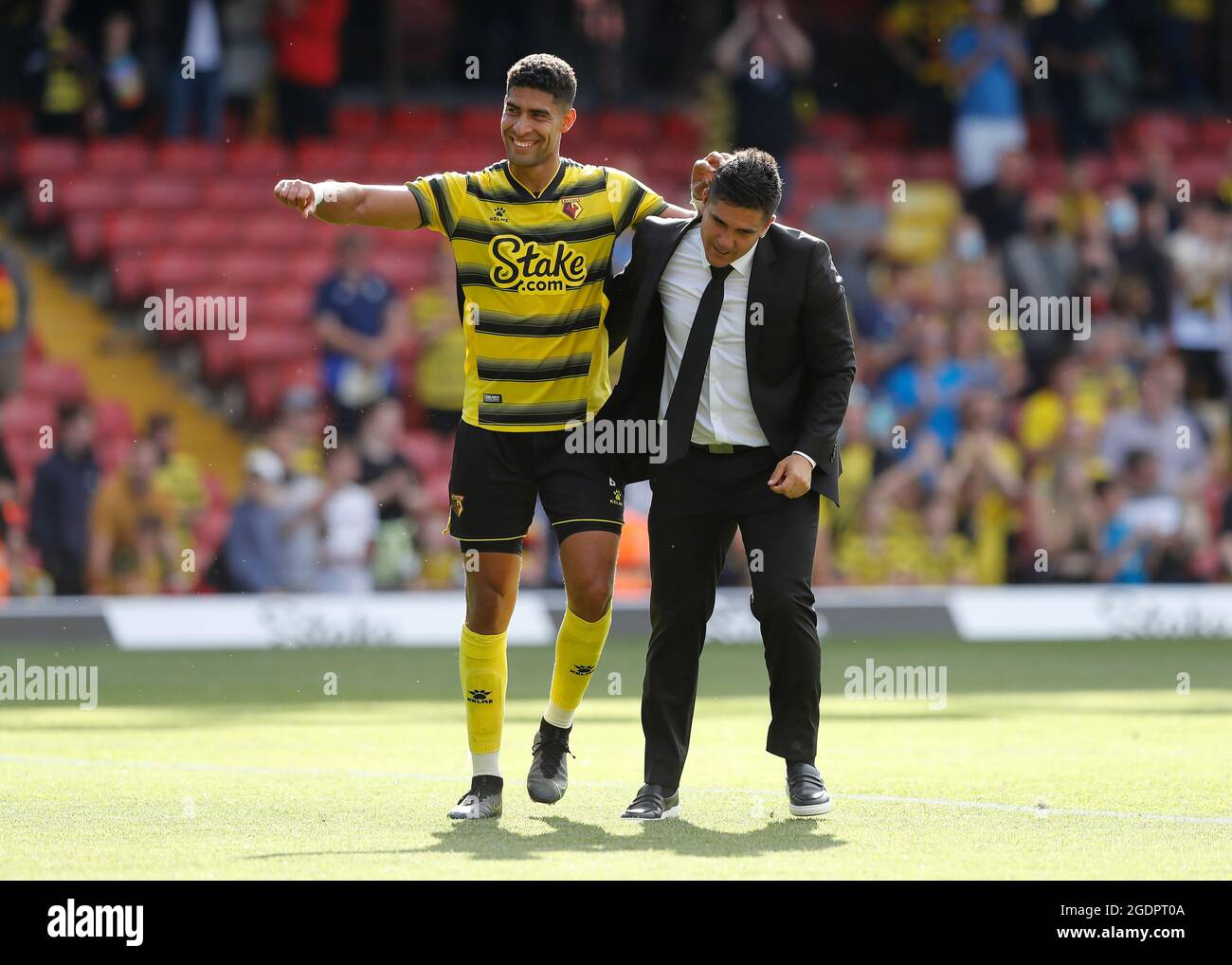 14th August 2021; Vicarage Road Stadium, Watford, Herts, England; Premier League football, Watford versus Aston Villa; Watford Manager Xisco Munoz celebrates with Adam Masina of Watford after the final whistle Stock Photo