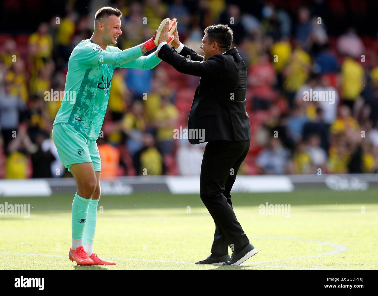 14th August 2021; Vicarage Road Stadium, Watford, Herts, England; Premier League football, Watford versus Aston Villa; Watford Manager Xisco Munoz celebrates with Goalkeeper Daniel Bachmann of Watford after the final whistle Stock Photo