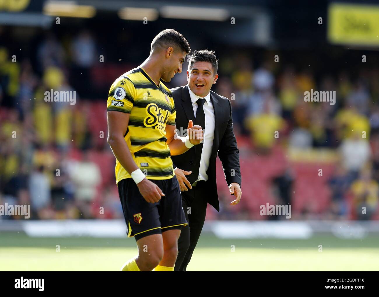 14th August 2021; Vicarage Road Stadium, Watford, Herts, England; Premier League football, Watford versus Aston Villa; Watford Manager Xisco Munoz celebrates with Adam Masina of Watford after the final whistle Stock Photo