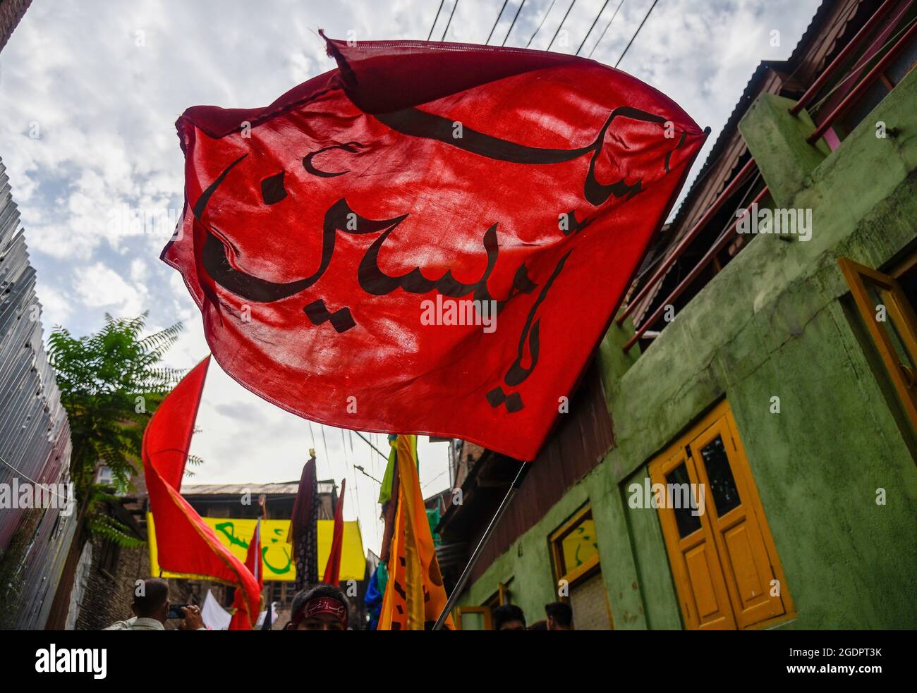 Srinagar, India. 14th Aug, 2021. A Kashmiri Muslim kid waves a ...