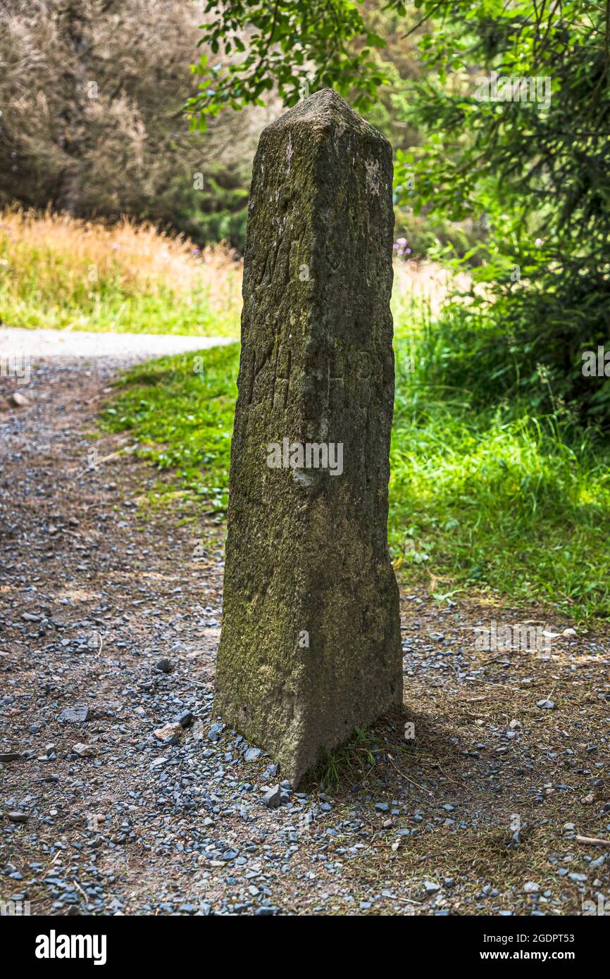 The Triangular Stake is a historical boundary stone. Kingdom of Hanover (KH) borders with Duchy of Brunswick (HB). During the cold war the stone marked the inner-German border. Wernigerode, Germany Stock Photo