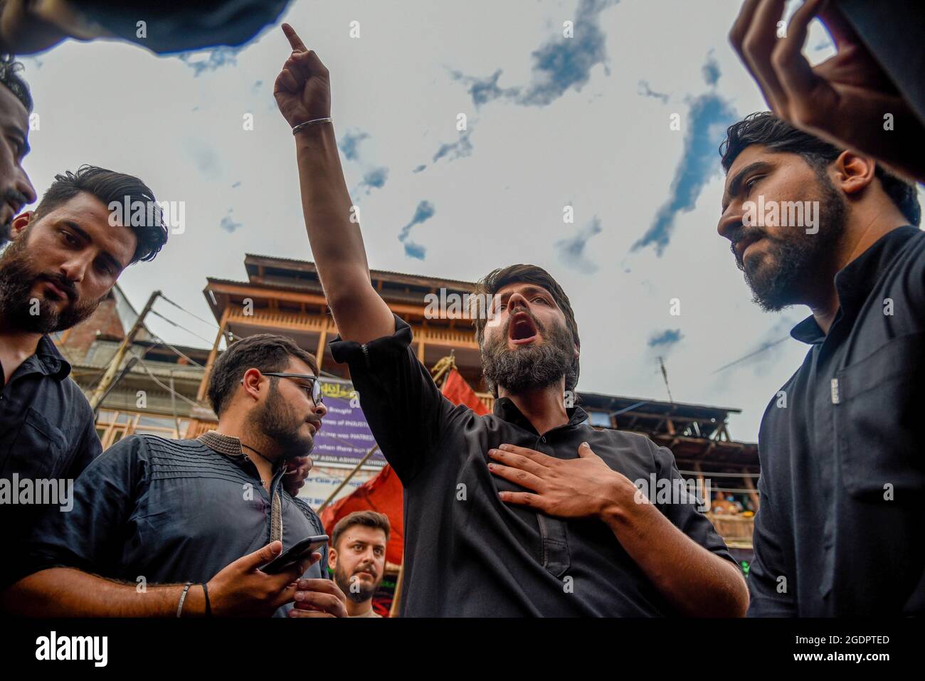 A Kashmiri man shout religious slogans during a muharram procession in ...