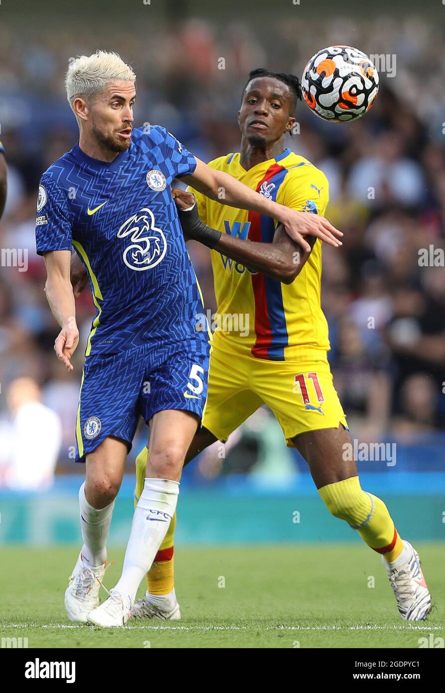 London, England, 14th August 2021. Jorginho of Chelsea  and Wilfried Zaha of Crystal Palace challenge for the ball during the Premier League match at Stamford Bridge, London. Picture credit should read: Paul Terry / Sportimage Stock Photo