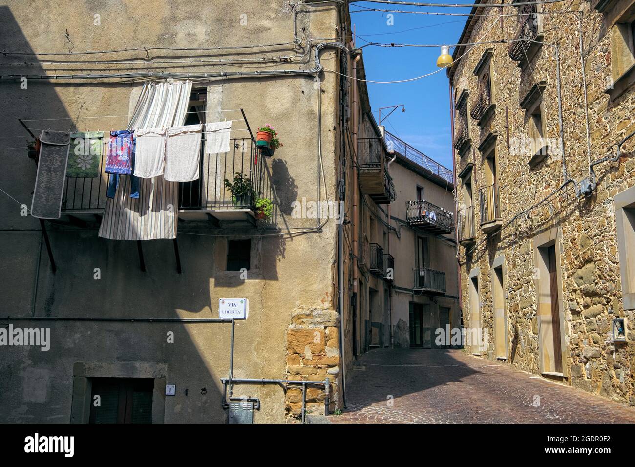 architecture and life mountain Old Town in Sicily narrow street and