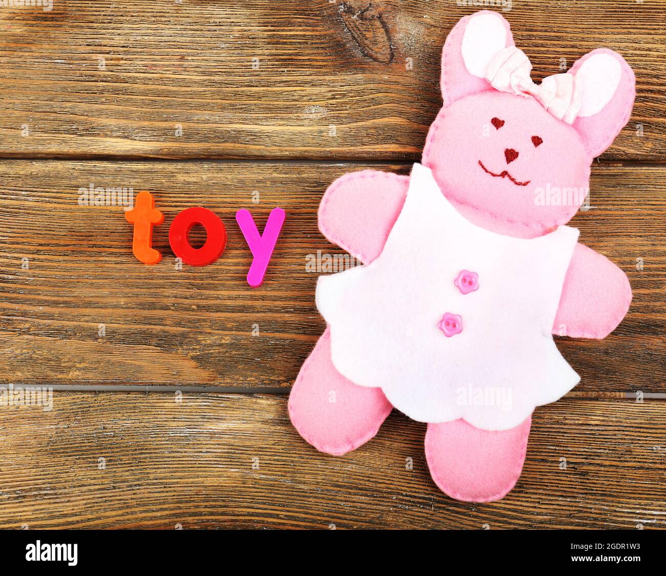 Toy word formed with colorful letters on wooden background Stock Photo
