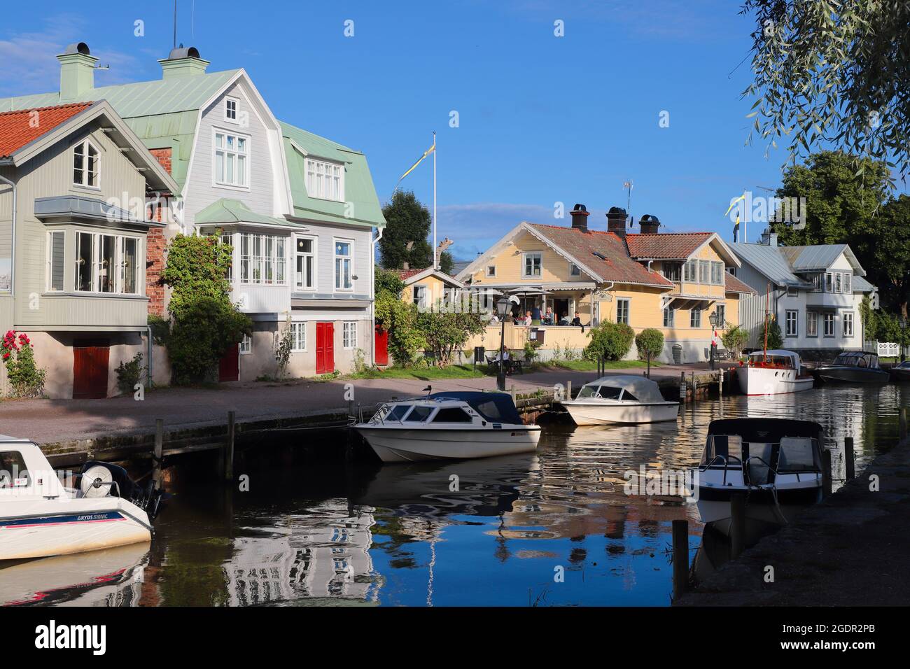Trosa, Sweden - August 8, 2021: View of the builings and pleasure boats  alongside the Trosa river. Stock Photo