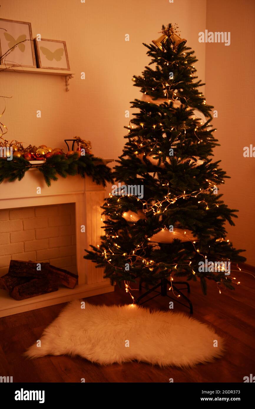 Christmas tree near fireplace in room Stock Photo Alamy
