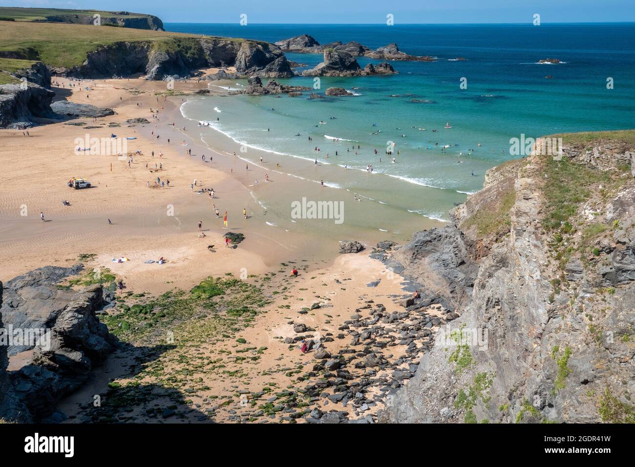 Looking down from the cliffs at the beach at Cornwall's Porthcothan bay on beautiful summer's day Stock Photo