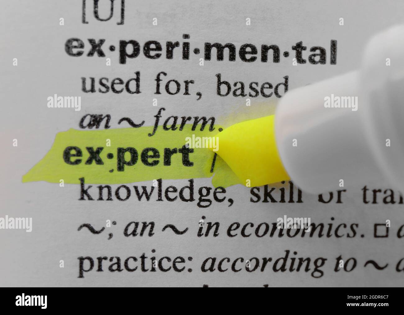 Yellow marker highlighting word in dictionary Stock Photo Alamy
