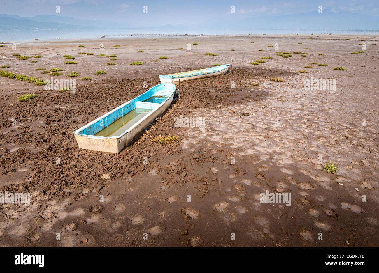Abandoned boats on a dry lake as a result of drought in Michoacan, Mexico. Stock Photo