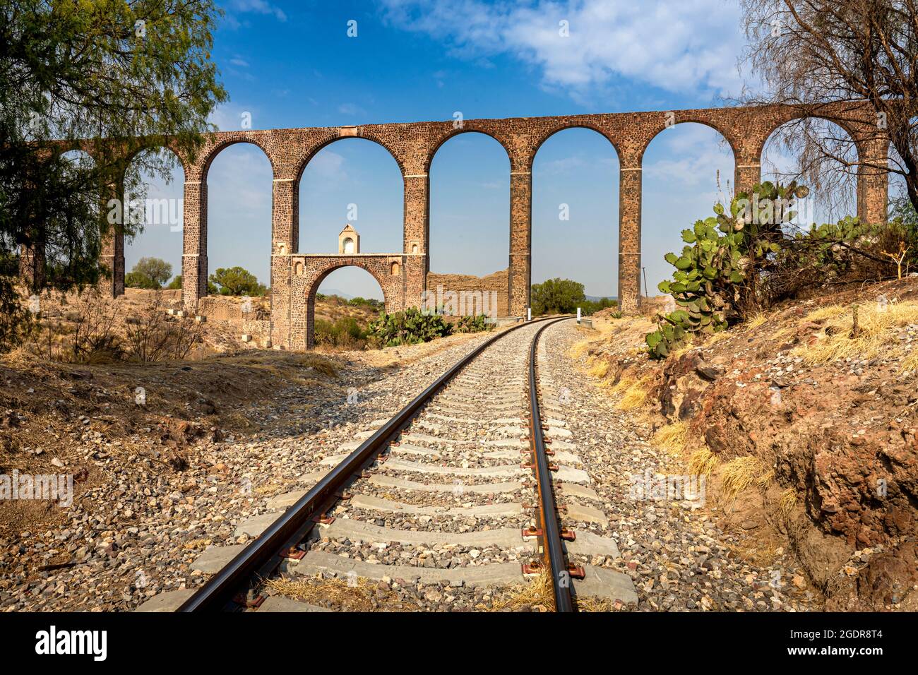 Father Tembleque Aqueduct and railroad tracks in the countryside of Hidalgo, Mexico. Stock Photo