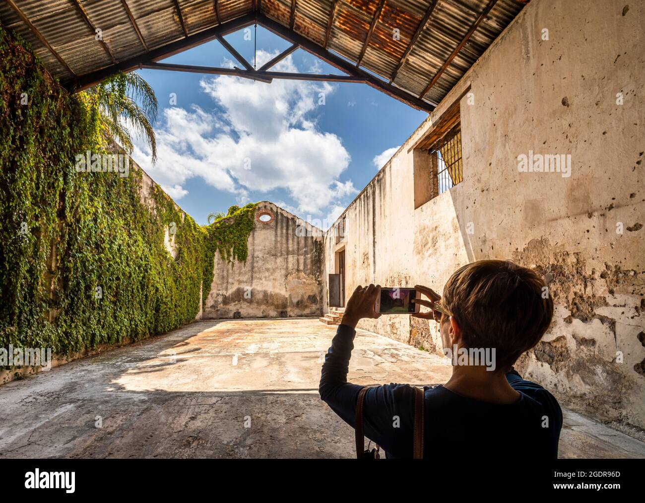 Woman photographs the Troje hall in the Ex-hacienda La Venta, San Juan del Rio, Queretaro, Mexico. Stock Photo