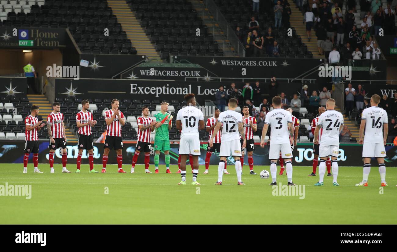 Swansea, Wales, 14th August 2021. Players of both teams applause for the covid deaths during the Sky Bet Championship match at the Swansea.com Stadium, Swansea. Picture credit should read: Simon Bellis / Sportimage Stock Photo