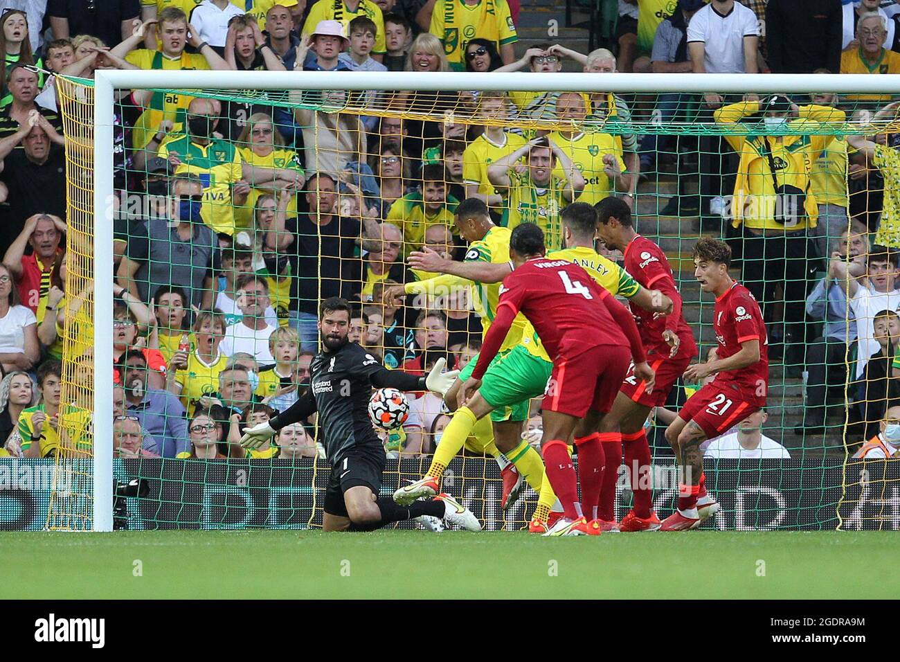 Norwich, UK. 14th Aug, 2021. Alisson Becker of Liverpool blocks the shot on goal by Grant Hanley of Norwich City during the Premier League match between Norwich City and Liverpool at Carrow Road on August 14th 2021 in Norwich, England. (Photo by Mick Kearns/phcimages.com) Credit: PHC Images/Alamy Live News Stock Photo