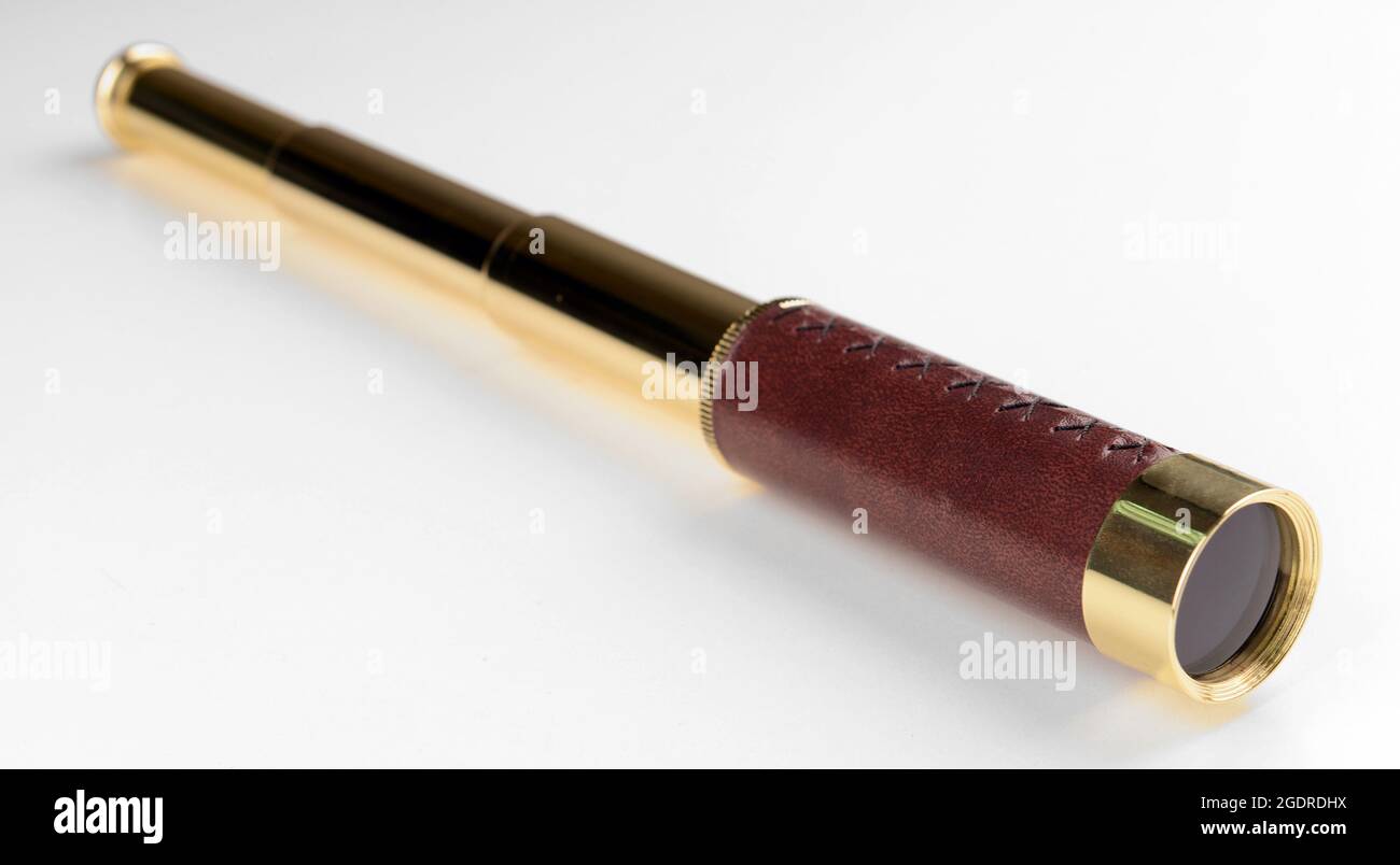 Modern spyglass isolated on white Stock Photo - Alamy