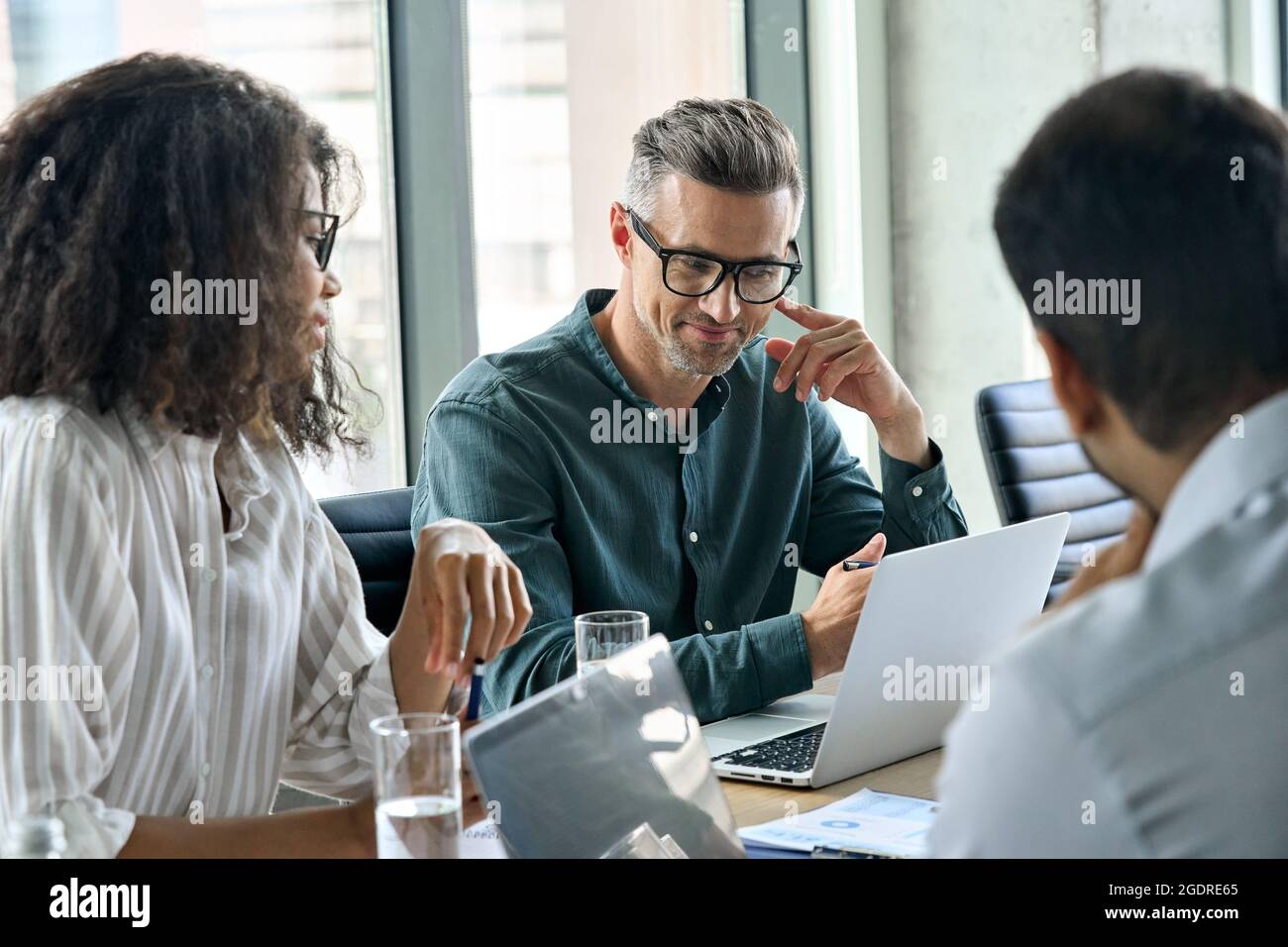 Diverse business executive team working together at boardroom meeting. Stock Photo