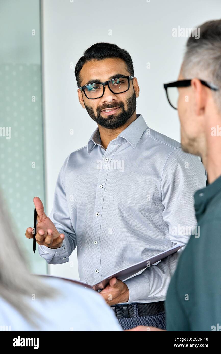 Indian executive ceo having discussion at boardroom with international team. Stock Photo