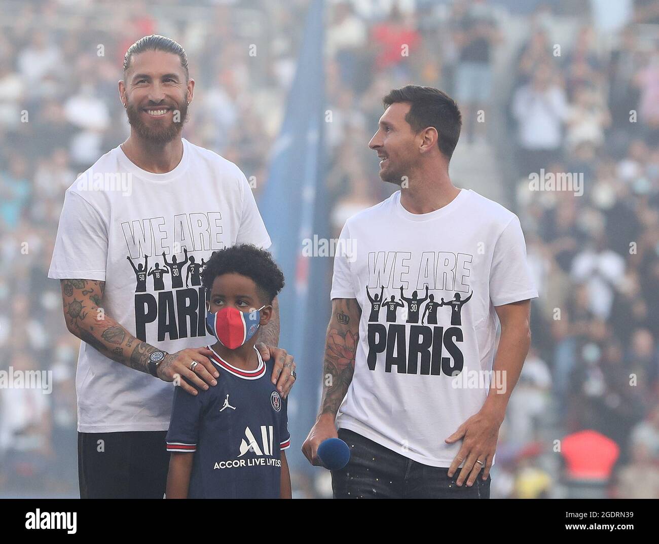 Paris, France. 14th Aug, 2021. Spanish defender Sergio Ramos (L) and Argentinian forward Lionel Messi (R) attend the new recruits presentation ceremony prior to the French Ligue 1 football match between Paris Saint-Germain and Racing Club Strasbourg at the Parc des Princes stadium in Paris, France, Aug. 14, 2021. Credit: Gao Jing/Xinhua/Alamy Live News Stock Photo