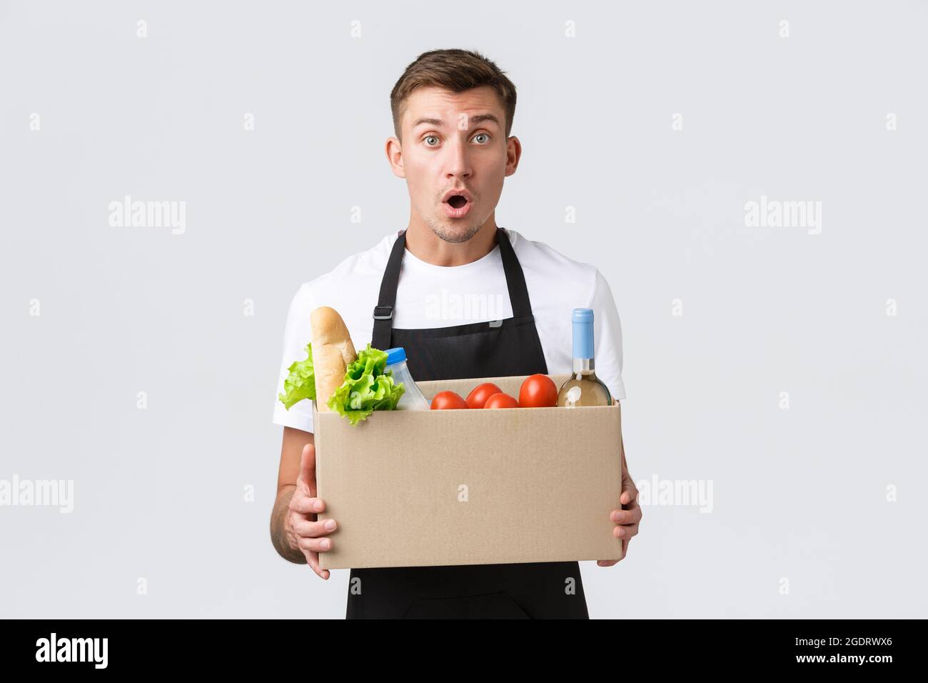 Retail, grocery shopping and delivery concept. Excited salesman