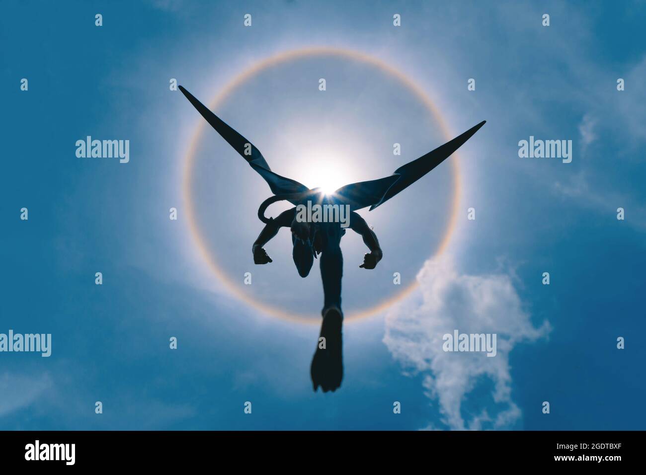 Bangkok, Thailand - August 14, 2021 : Plastic figurine of Devilman from Devilman manga series and animation  with fantastic sun halo. Editorial use on Stock Photo