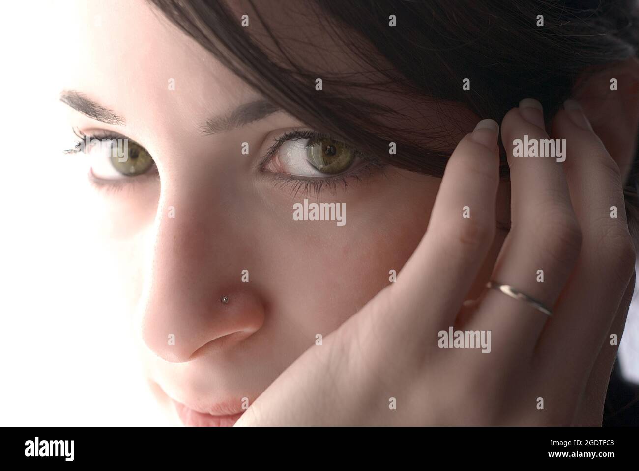 close up portrait of girl face with beautiful eyes who are looking at the camera Stock Photo