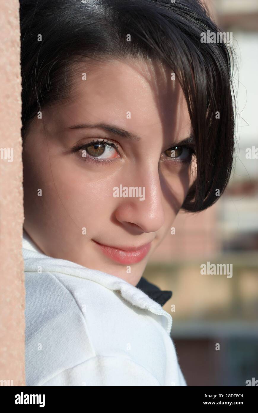 close up portrait of smiling girl face eyes who are looking at the camera Stock Photo