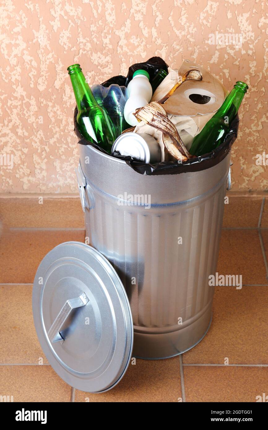 Recycling bin on wall background Stock Photo - Alamy