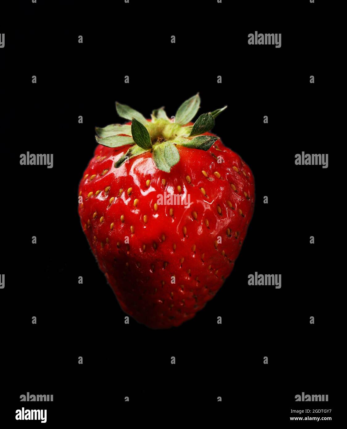 Strawberry on black background Stock Photo - Alamy