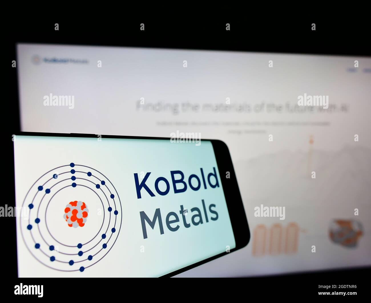 Smartphone with logo of US mining technology company KoBold Metals on screen in front of business website. Focus on center-left of phone display. Stock Photo