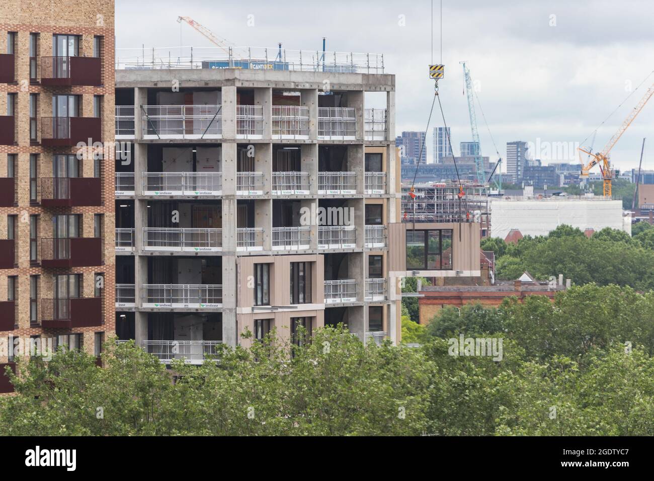Modular element being hoisted to a new building Stock Photo - Alamy