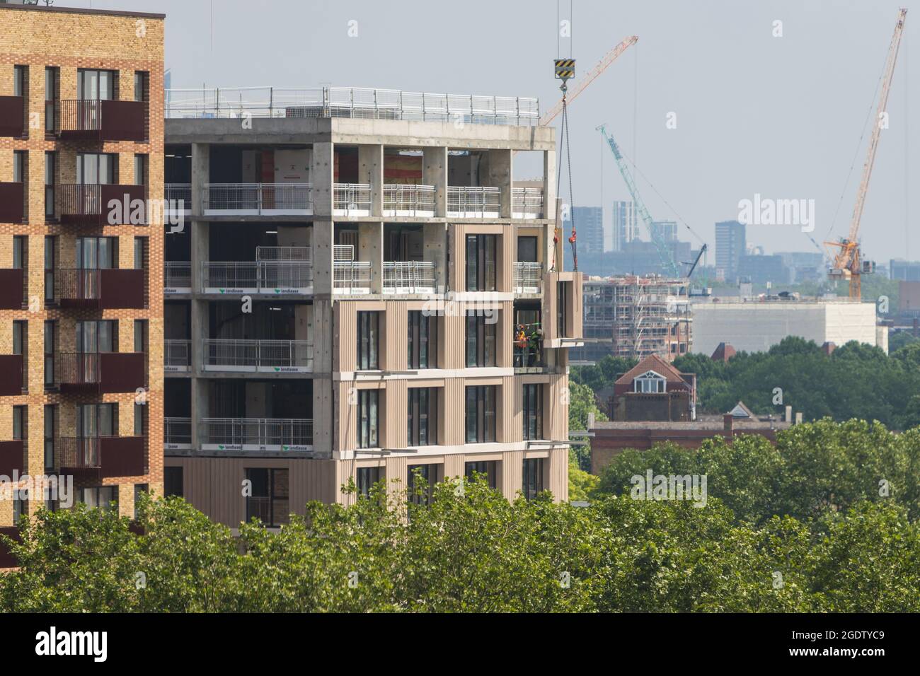 Modular element being hoisted to a new building Stock Photo - Alamy